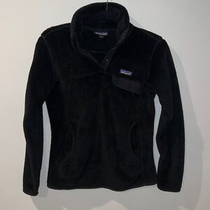 Patagonia black  snap pull over w/ big center pocket & one small chest pocket